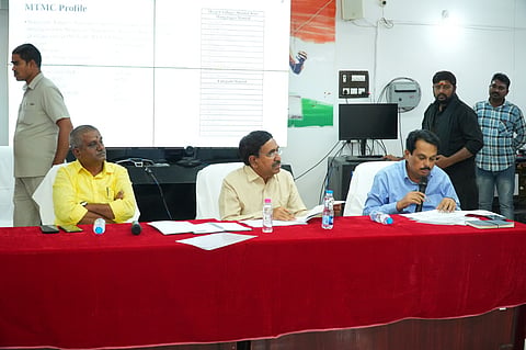 At the MTMC office in Mangalagiri, officials briefed Minister Narayana (C) on ongoing civic projects.