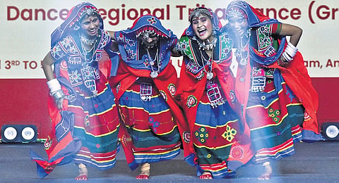 Ekalavya School students perform a tribal dance at the 6th National EMRS Cultural Festival at KL University in Vaddeswaram of Guntur district