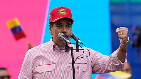 Venezuelan President Nicolas Maduro addresses supporters during a swearing-in event for government-organized community committees at the presidential palace in Caracas, Venezuela, Monday, Dec. 1, 2025.