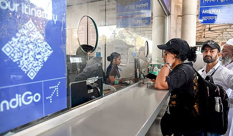 Passengers at an IndiGo airlines counter amid flight disruptions, at Chhatrapati Shivaji Maharaj International Airport in Mumbai, Sunday, Dec. 7, 2025.