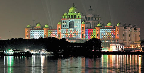 The state Secretariat is lit up with images showcasing women empowerment, on the eve of the Telangana Rising Global Summit, in Hyderabad on Sunday.