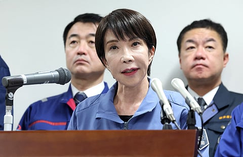 Japan's Prime Minister Sanae Takaichi responds to questions from reporters after completing her inspection tour in Wajima City, Ishikawa Prefecture on December 7, 2025