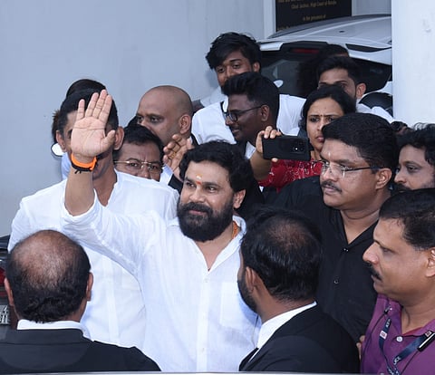 Malayalam actor Dileep emerges from the Ernakulam Principal Sessions Court, surrounded by media and fans, after being acquitted in the 2017 actor abduction case.