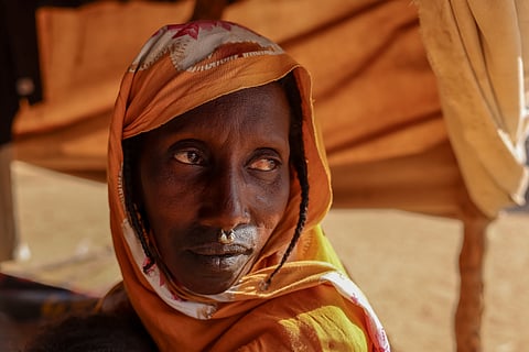 A Fulani woman who fled violence in Mali sits at a camp in Fassala, Mauritania, Sunday, Nov. 9, 2025, where she has found refuge.