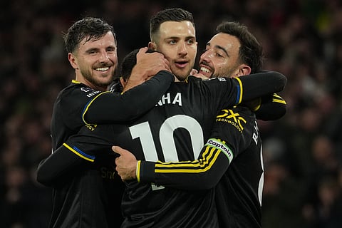 Manchetser United players celebrate after a goal during the Premier League soccer match.