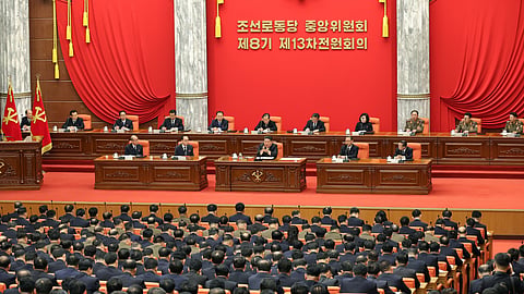 In this photo provided by the North Korean government, North Korean leader Kim Jong Un, center, attends a plenary meeting of the Workers Party's Central Committee in North Korea, Tuesday, Dec. 9, 2025.