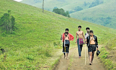 Devotees trekking through Sathram Pulmedu