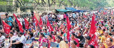 Sanitary workers staging a protest near the collectorate on Wednesday | Express