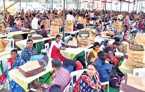 Polling officials busy checking election material for the gram panchayat elections
in Manakondur of Karimnagar district on Saturday.