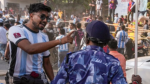 Security personnel lathi-charge to disperse fans after they gathered near the VYBK stadium following chaos at an event of Argentine footballer Lionel Messi as part of his 'G.O.A.T.