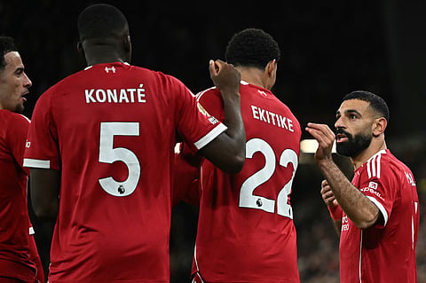 Liverpool's Mohamed Salah talks to Hugo Ekitike after the latter scored the second goal. (Photo | AFP)