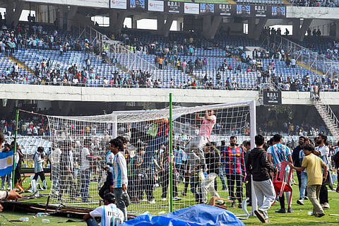 Angry fans on the field as they vandalise the Salt Lake Stadium, alleging poor management during Argentine footballer Lionel Messi's G.O.A.T India Tour 2025, in Kolkata
