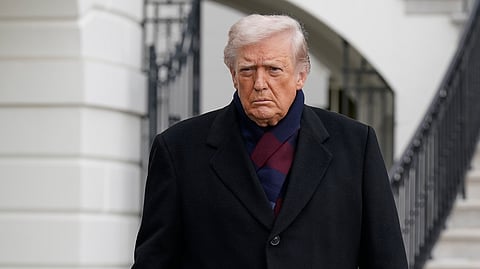 US President Donald Trump talks to reporters as he departs from the South Lawn of the White House, Saturday, Dec. 13, 2025, in Washington.
