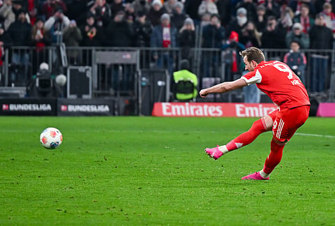 Munich's Harry Kane scores his side's second goal during the German Bundesliga soccer match between FC Bayern Munich and FSV Mainz 05 in Munich, Germany, Sunday, Dec. 14, 2025.