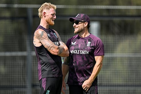 England’s Ben Stokes withcoach Brendon McCullum