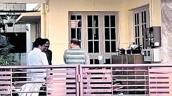 Lokayukta sleuths wait in front of Rajashekar Bijapur’s residence