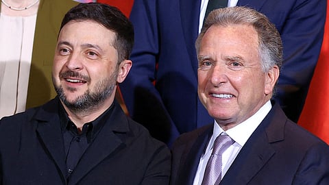 Ukraine's President Volodymyr Zelenskyy (L) and US Special Envoy Steve Witkoff gather for a family photo at the Chancellery in Berlin, Monday, Dec. 15, 2025.