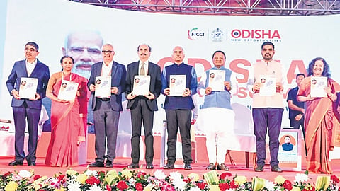 Chief Minister Mohan Charan Majhi and Industries Minister Sampad Chandra Swain releasing the Odisha Pharmaceutical and Medical Devices Policy 2025 at Odisha Pharma Summit, in Bhubaneswar on Tuesday | express