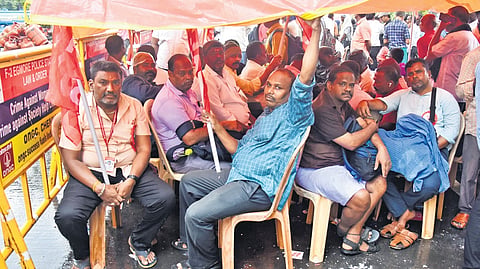 Tasmac employees staging a wait-in protest in Chennai on Tuesday