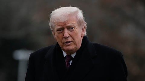 President Donald Trump looks over after stepping off Marine One on the South Lawn of the White House, Wednesday, Dec. 17, 2025, in Washington.