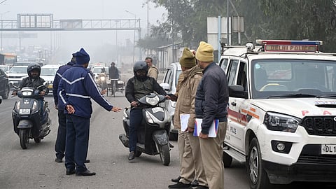 raffic police personnel stop a vehicle for document verification at the Delhi- UP Border (Ghazipur), in New Delhi, Thursday, Dec. 18, 2025.