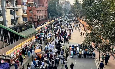 People gather in large numbers for the funeral of prominent youth leader Sharif Osman Hadi following unrest in Bangladesh triggered by his death, at the South Plaza of the National Parliament Building, in Dhaka, Saturday, Dec. 20, 2025.