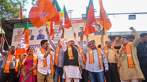 BJP Maharashtra President Ravindra Chavan, third right, and party leaders celebrate victory in the Maharashtra local body elections, at the BJP head office, in Mumbai, Sunday, Dec. 21, 2025.