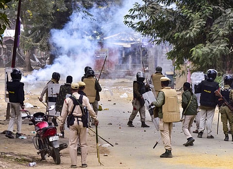 Security personnel deployed to maintain law and order after a clash between two groups over the issue of eviction, at Kheroni in West Karbi Anglong district, Assam, Tuesday, Dec. 23, 2025.