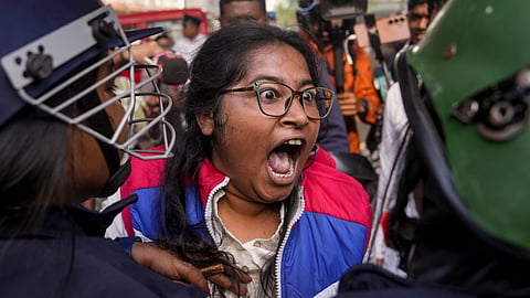 West Bengal Hindu Jagran member during a protest near Bangladesh Deputy High Commission against alleged violence on minority Hindus in the neighbouring country, in Kolkata, Tuesday, Dec. 23, 2025.
