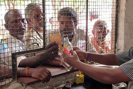 People buying Liquor at the Tasmac Shop