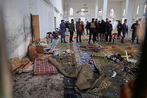 Syrian security forces inspect the damage after an explosion in the Imam Ali bin Abi Talib Mosque in a predominantly Alawite area of the Wadi al-Dhahab neighborhood in Homs, Syria Friday, Dec. 26, 2025.