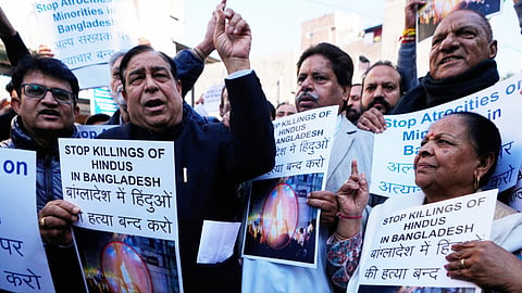 Congress party supporters hold placards during a protest alleging that Bangladeshi groups are wrongly targeting Hindus in Bangladesh, in Jammu, India, Wednesday, Dec. 24, 2025.