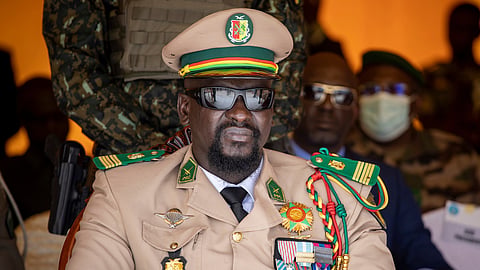 Guinea's junta leader Col. Mamady Doumbouya watches over an independence day military parade in Bamako, Mali, on Sept. 22, 2022.