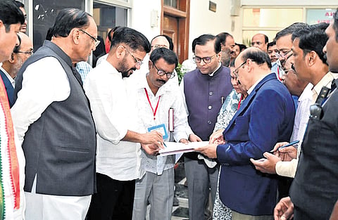 Chief Minister A Revanth Reddy inspects the ongoing repair works at the Legislative Council building located on the Assembly premises in Hyderabad on Monday.