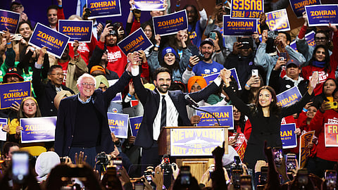 Vermont Senator Bernie Sanders, left, New York City mayoral candidate Zohran Mamdani, center, and Rep. Alexandria Ocasio-Cortez, D-N.Y., appear on stage during a rally, Sunday, Oct. 26, 2025, in New York.