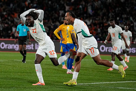 Ivory Coast's Evann Guessand celebrates after scoring during the Africa Cup of Nations group F soccer match between Gabon and Ivory Coast, in Marrakech, Morocco, Wednesday, Dec. 31, 2025.