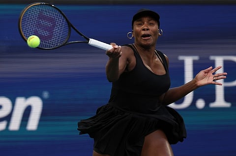 Venus Williams, of the United States, returns a shot with partner Leylah Fernandez, of Canada, during a quarterfinal doubles.