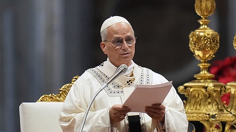 Pope Leo XIV reads the homily as he celebrates Mass on New Year's Day in St. Peter's Basilica at the Vatican, Thursday, Jan. 1, 2026.