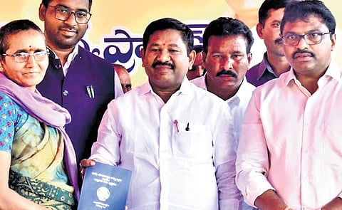Dola Sree Bala Veeranjaneya Swamy, along with district officials, launched the distribution of new Pattadar Pass Books in the Addanki Assembly segment on Friday.