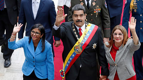 FILE - Venezuela's President Nicolas Maduro, then Constituent National Assembly President Delcy Rodriguez, left, and first lady Cilia Flores, wave as they arrive to the National Assembly, in Caracas, Venezuela, May 24, 2018.