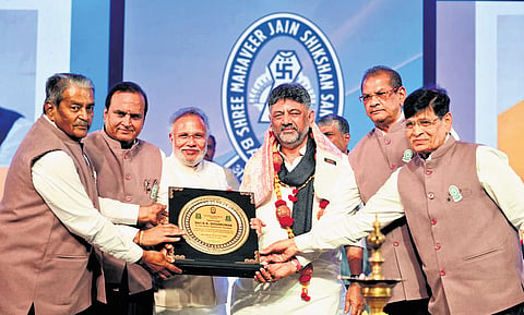 DCM D K Shivakumar at the 40th anniversary programme of BBUL Jain Vidyalaya and the 25th anniversary of CB Bhandari Jain College in Bengaluru on Sunday | Express