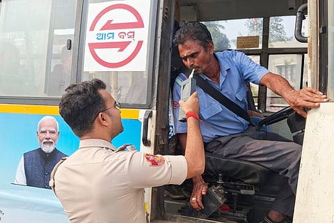 An Ama Bus driver undergoes breath analyser test in Bhubaneswar