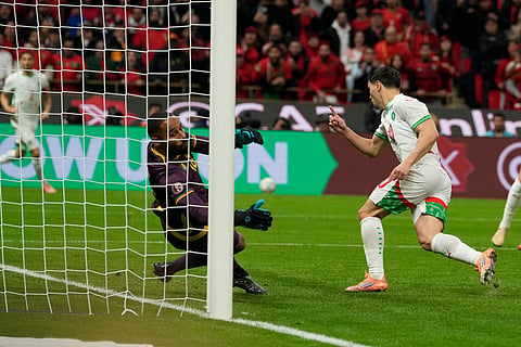 Morocco's Brahim Abdelkader Díaz, right, scores his side's opening goal during the Africa Cup of Nations quarterfinal soccer match between Cameroon and Morocco, in Rabat, Morocco, Friday, Jan. 9, 2026.