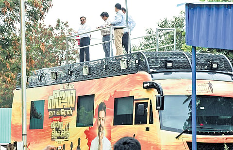 CBI officials and Central Forensic Science Laboratory experts examine the campaign vehicle used by TVK leader Vijay, in Karur on Saturday