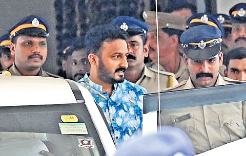 Police bring Palakkad MLA Rahul Mamkootathil out of the AR Camp
in Pathanamthitta