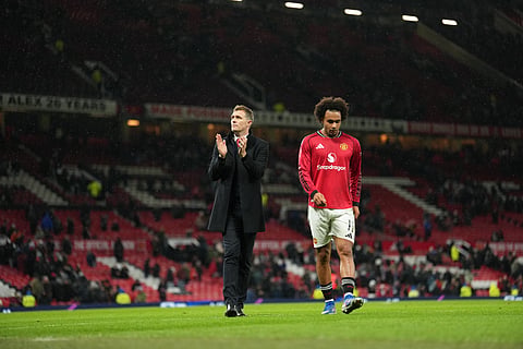 Manchester United's interim manager Darren Fletcher and Manchester United's Joshua Zirkzee walk off the pitch after the FA Cup third round soccer match between Manchester United and Brighton on Jan. 11, 2026.
