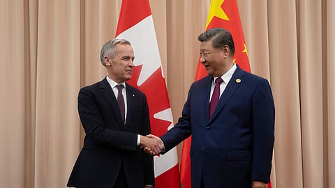 FILE - Canadian Prime Minister Mark Carney, left, shakes hands with Chinese President Xi Jinping at the start of a meeting in Gyeongju, South Korea, Oct. 31, 2025.