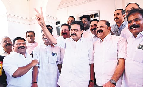Kerala Congress(M) chairman Jose K Mani showing the victory sign at the party state committee office in Kottayam on Wednesday.