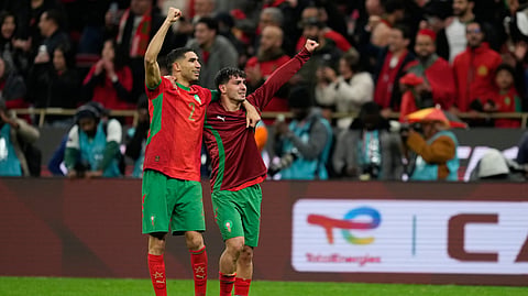 Morocco's Achraf Hakimi, left, and Brahim Abdelkader Díaz celebrate after winning the penalty shootout during the Africa Cup of Nations semi-final match between Nigeria and Morocco in Rabat, Morocco, Wednesday, Jan. 14, 2026.