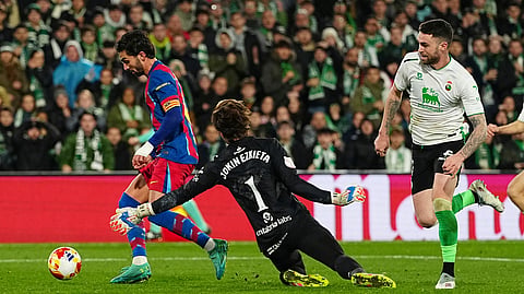 Barcelona's Ferran Torres, left, scores the opening goal during the Copa del Rey round of 16 soccer match between Racing Santander and Barcelona, in Santander, Spain, Thursday, Jan. 15, 2026.